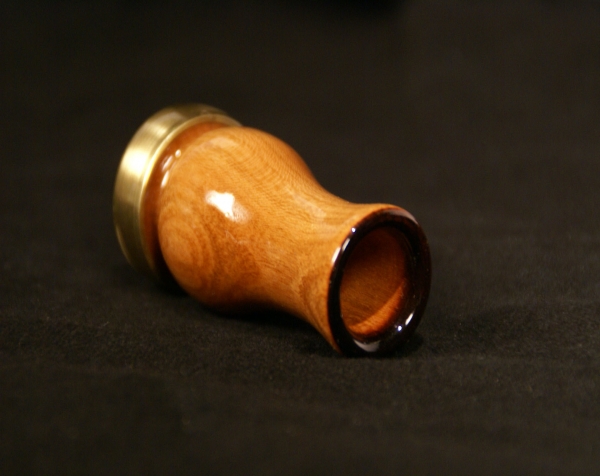 Custom wood turning made into a wood game call with a clear lacquer finish and ferrule